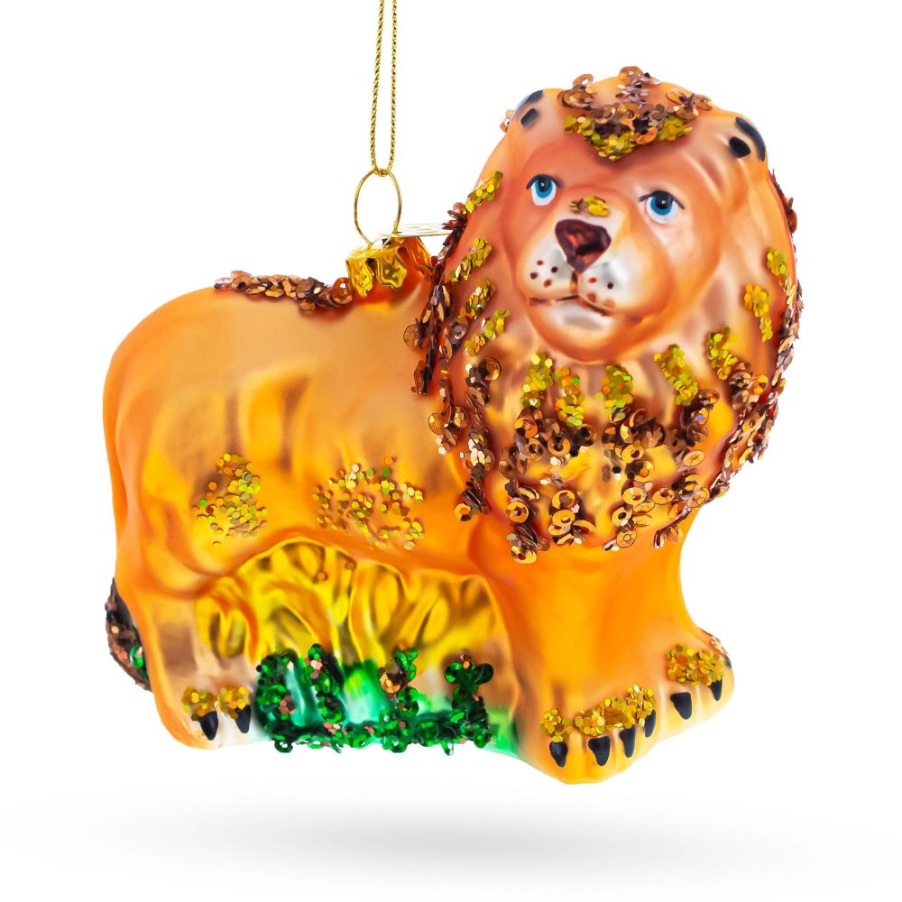 Lion On The Grass Blown Glass Christmas Ornament  |   Animals Animals Animals